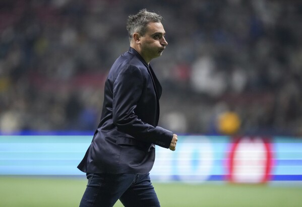 Whitecaps coach deals